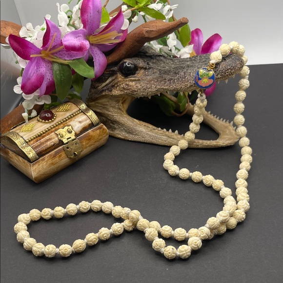 Hand carved bone necklace with floral cloisonné clasp C2